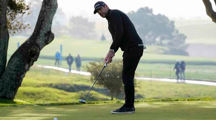 Aaron Rodgers watches a putt in the third round of the 2023 AT&T Pebble Beach Pro-Am.